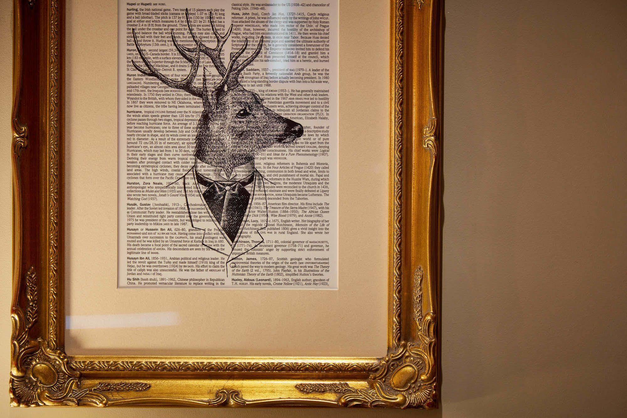 Oddfellows On The Park Чедл Экстерьер фото A framed print of a deer head with a bow tie